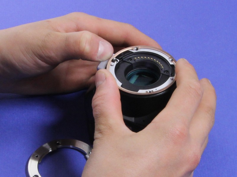Bronze optical shim positioned on camera mount